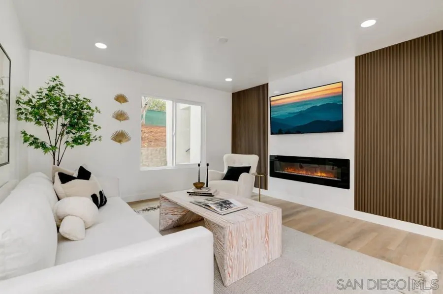 Living room with fireplace and slatted wood panels