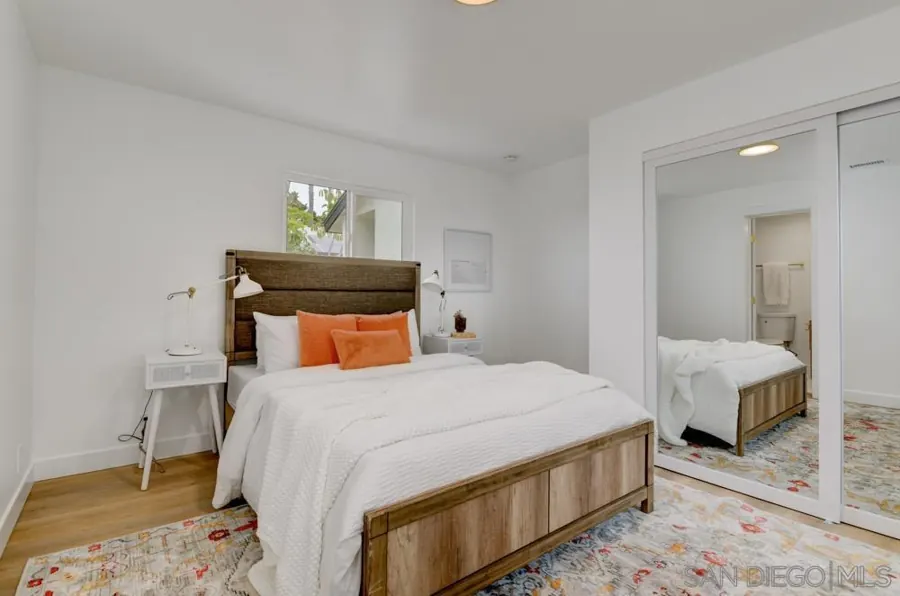 Bedroom with mirrored closet doors