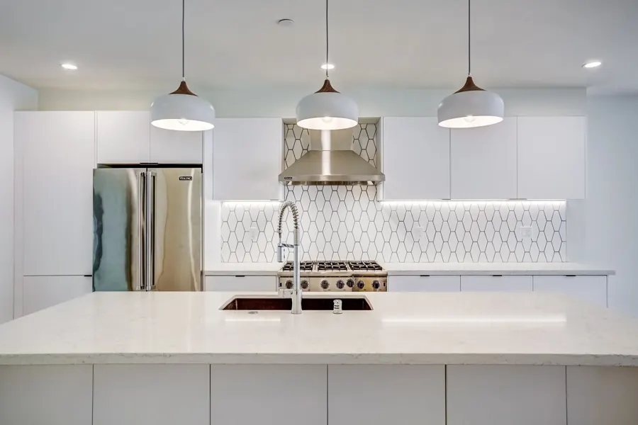 White kitchen with geometric tile backsplash