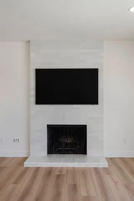 Living room fireplace with white tile surround