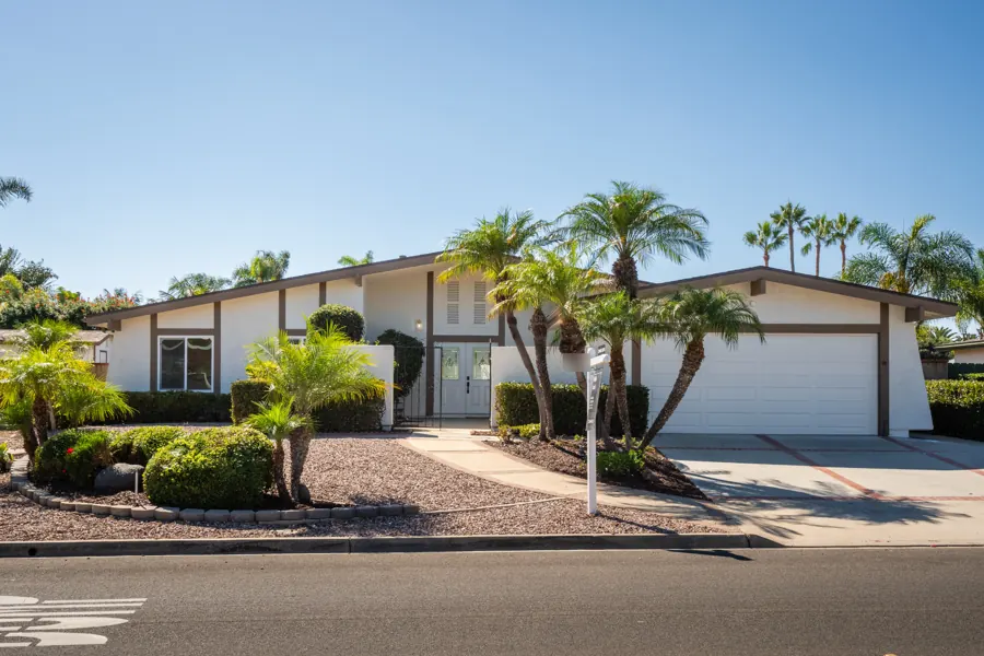 Front exterior with palms