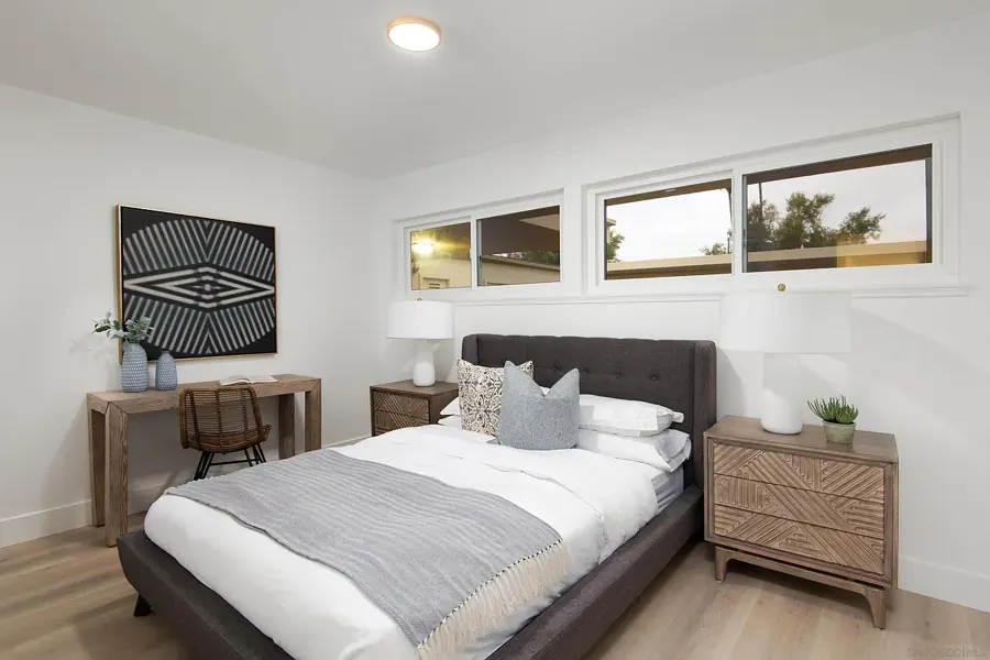 Bedroom with clerestory windows and desk